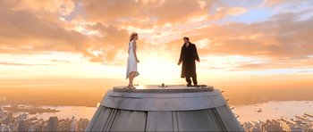 Movie still from “King Kong” (2005), directed by Peter Jackson – A man and a woman standing on top of a building; Wide shot, Low angle