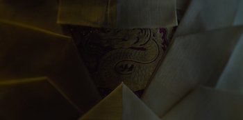 Movie still from “Kingdom: Ashin of the North” (2021), directed by Kim Seong-hun – View of a fabric with a dragon on it; Extreme Close Up shot, Overhead angle