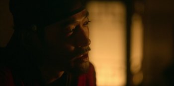 Movie still from “Kingdom: Ashin of the North” (2021), directed by Kim Seong-hun – A person looking at the camera; Close Up shot, Over the shoulder angle