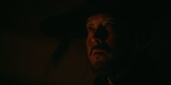 Movie still from “Kingdom: Ashin of the North” (2021), directed by Kim Seong-hun – A person wearing a hat; Close Up shot, Low angle
