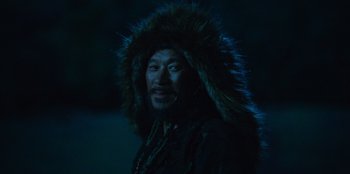 Movie still from “Kingdom: Ashin of the North” (2021), directed by Kim Seong-hun – A man wearing a fur coat and a fur hat; Close Up shot, Over the shoulder angle