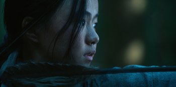 Movie still from “Kingdom: Ashin of the North” (2021), directed by Kim Seong-hun – A person with long black hair; Extreme Close Up shot, Over the shoulder angle