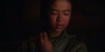 Movie still from “Kingdom: Ashin of the North” (2021), directed by Kim Seong-hun – A young girl is looking down at her neck; Close Up shot, High angle
