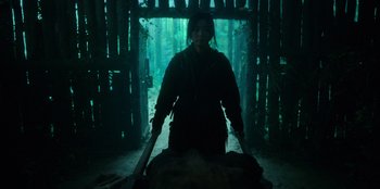 Movie still from “Kingdom: Ashin of the North” (2021), directed by Kim Seong-hun – A woman standing next to a dead animal in the woods; Wide shot, Low angle