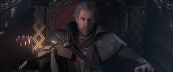 Movie still from “Kingsglaive: Final Fantasy XV” (2016), directed by Takeshi Nozue – An old man with a long beard wearing a suit and holding a sword; Close Up shot, Over the shoulder angle