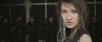 Movie still from “Kingsglaive: Final Fantasy XV” (2016), directed by Takeshi Nozue – A person wearing a leather jacket; Close Up shot, Over the shoulder angle