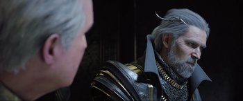 Movie still from “Kingsglaive: Final Fantasy XV” (2016), directed by Takeshi Nozue – An old man with a long gray beard and silver hair; Close Up shot, Over the shoulder angle