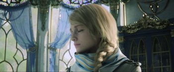 Movie still from “Kingsglaive: Final Fantasy XV” (2016), directed by Takeshi Nozue – A woman with long blonde hair wearing a blue and white scarf; Close Up shot, Low angle