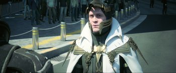 Movie still from “Kingsglaive: Final Fantasy XV” (2016), directed by Takeshi Nozue – A man in a costume standing on the side of the street; Close Up shot, Over the shoulder angle
