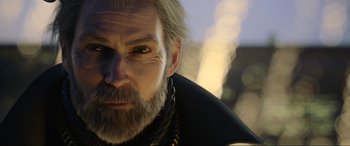 Movie still from “Kingsglaive: Final Fantasy XV” (2016), directed by Takeshi Nozue – An old man with a long gray beard; Close Up shot, Over the shoulder angle