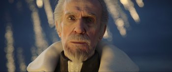 Movie still from “Kingsglaive: Final Fantasy XV” (2016), directed by Takeshi Nozue – An old man with a beard is looking at the camera; Close Up shot, Low angle