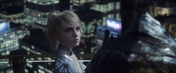 Movie still from “Kingsglaive: Final Fantasy XV” (2016), directed by Takeshi Nozue – A woman with blonde hair standing in front of a window; Close Up shot, Over the shoulder angle