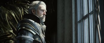 Movie still from “Kingsglaive: Final Fantasy XV” (2016), directed by Takeshi Nozue – A man with a long gray beard looking out of a window; Close Up shot, Low angle