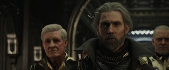 Movie still from “Kingsglaive: Final Fantasy XV” (2016), directed by Takeshi Nozue – Two older men standing next to each other in a room; Close Up shot, Over the shoulder angle