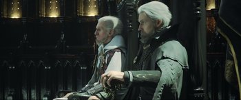 Movie still from “Kingsglaive: Final Fantasy XV” (2016), directed by Takeshi Nozue – A couple of men sitting next to each other on a chair; Close Up shot, Over the shoulder angle
