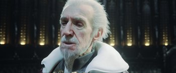 Movie still from “Kingsglaive: Final Fantasy XV” (2016), directed by Takeshi Nozue – An old man with white hair and a white beard; Close Up shot, Over the shoulder angle