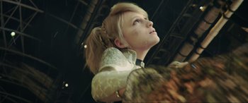 Movie still from “Kingsglaive: Final Fantasy XV” (2016), directed by Takeshi Nozue – A woman in a white dress looking up at the sky; Close Up shot, Low angle