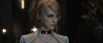 Movie still from “Kingsglaive: Final Fantasy XV” (2016), directed by Takeshi Nozue – A person wearing a necklace; Close Up shot, Over the shoulder angle
