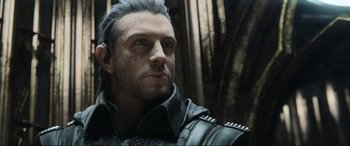Movie still from “Kingsglaive: Final Fantasy XV” (2016), directed by Takeshi Nozue – A person wearing a leather jacket; Close Up shot, Low angle