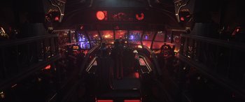 Movie still from “Kingsglaive: Final Fantasy XV” (2016), directed by Takeshi Nozue – A view of a room with a lot of red lights; Extreme Wide shot, High angle