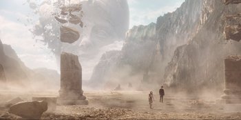 Movie still from “Knights of the Zodiac” (2023), directed by Tomasz Baginski – A man and a woman are standing in the desert; Extreme Wide shot, Low angle