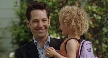 Movie still from “Knocked Up” (2007), directed by Judd Apatow – A man holding a little girl in his arms; Close Up shot, Over the shoulder angle