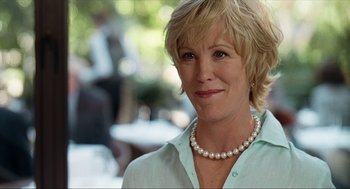 Movie still from “Knocked Up” (2007), directed by Judd Apatow – A person wearing a pearl necklace; Close Up shot, Over the shoulder angle