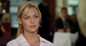 Movie still from “Knocked Up” (2007), directed by Judd Apatow – A woman with blonde hair wearing a pink shirt; Close Up shot, Over the shoulder angle