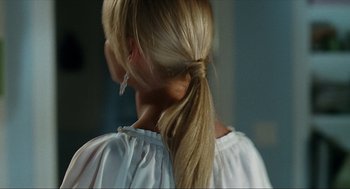 Movie still from “Knocked Up” (2007), directed by Judd Apatow – A woman with blonde hair is wearing a white shirt; Close Up shot, Over the shoulder angle