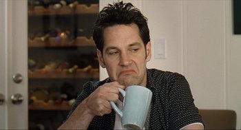 Movie still from “Knocked Up” (2007), directed by Judd Apatow – A person holding a cup of coffee; Close Up shot, Low angle