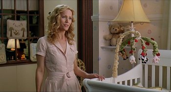 Movie still from “Knocked Up” (2007), directed by Judd Apatow – A woman standing in front of a baby's crib; Medium shot, Over the shoulder angle