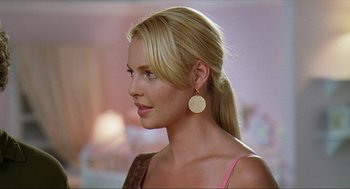 Movie still from “Knocked Up” (2007), directed by Judd Apatow – A woman with blonde hair wearing a pink top; Close Up shot, Over the shoulder angle