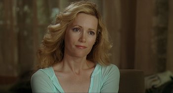 Movie still from “Knocked Up” (2007), directed by Judd Apatow – A person sitting on a couch; Close Up shot, Over the shoulder angle