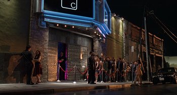 Movie still from “Knocked Up” (2007), directed by Judd Apatow – A crowd of people standing outside of a theater; Wide shot, High angle