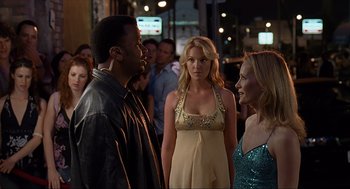 Movie still from “Knocked Up” (2007), directed by Judd Apatow – A group of people standing next to each other on the street; Medium shot, Over the shoulder angle