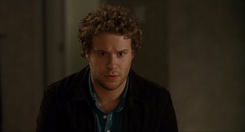 Movie still from “Knocked Up” (2007), directed by Judd Apatow – A person with curly hair; Close Up shot, Over the shoulder angle