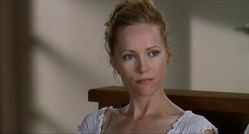 Movie still from “Knocked Up” (2007), directed by Judd Apatow – A beautiful woman with blonde hair wearing a white shirt; Close Up shot, Over the shoulder angle