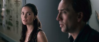 Movie still from “Knowing” (2009), directed by Alex Proyas – A man and a woman looking at one another; Close Up shot, Over the shoulder angle