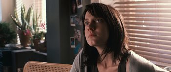 Movie still from “Knowing” (2009), directed by Alex Proyas – A young woman sitting in front of a window; Close Up shot, Low angle