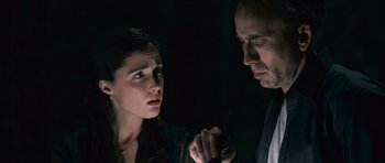 Movie still from “Knowing” (2009), directed by Alex Proyas – A man and a woman looking at one another; Close Up shot, Over the shoulder angle