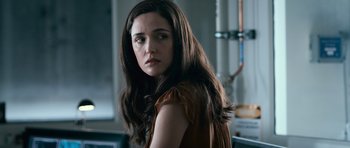 Movie still from “Knowing” (2009), directed by Alex Proyas – A beautiful young woman with long brown hair; Close Up shot, Over the shoulder angle