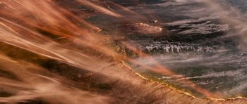 Movie still from “Knowing” (2009), directed by Alex Proyas – A view of a body of water with a lot of smoke coming out of it; Extreme Wide shot, Overhead angle