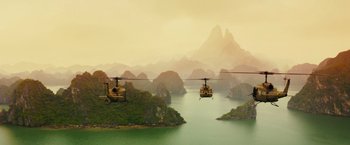 Movie still from “Kong: Skull Island” (2017), directed by Jordan Vogt-Roberts – A couple of helicopters flying over a body of water; Extreme Wide shot, High angle