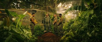 Movie still from “Kong: Skull Island” (2017), directed by Jordan Vogt-Roberts – A group of men standing in the jungle; Wide shot, Low angle