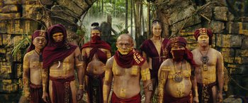 Movie still from “Kong: Skull Island” (2017), directed by Jordan Vogt-Roberts – A group of people standing next to each other in the woods; Wide shot, Low angle