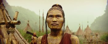 Movie still from “Kong: Skull Island” (2017), directed by Jordan Vogt-Roberts – A man with gold paint on his face and head; Close Up shot, Low angle
