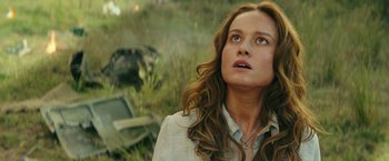 Movie still from “Kong: Skull Island” (2017), directed by Jordan Vogt-Roberts – A woman with long hair looking up at the sky; Close Up shot, Low angle