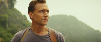 Movie still from “Kong: Skull Island” (2017), directed by Jordan Vogt-Roberts – A person with a shoulder bag; Close Up shot, Low angle