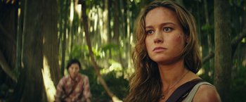 Movie still from “Kong: Skull Island” (2017), directed by Jordan Vogt-Roberts – A woman standing next to a man in the woods; Close Up shot, Over the shoulder angle