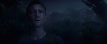 Movie still from “Kong: Skull Island” (2017), directed by Jordan Vogt-Roberts – A person looking at the camera; Close Up shot, Low angle